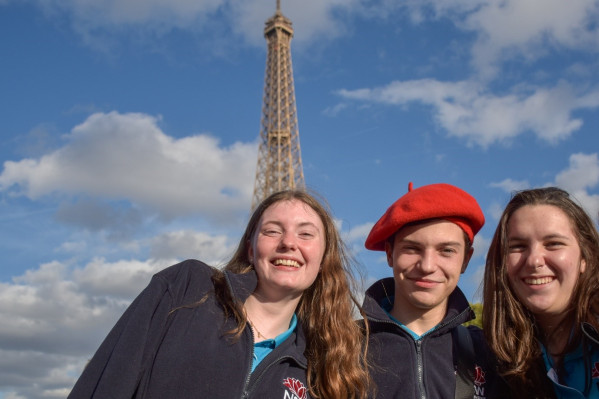 3 scholars in front of Paris' Eiffel Tower