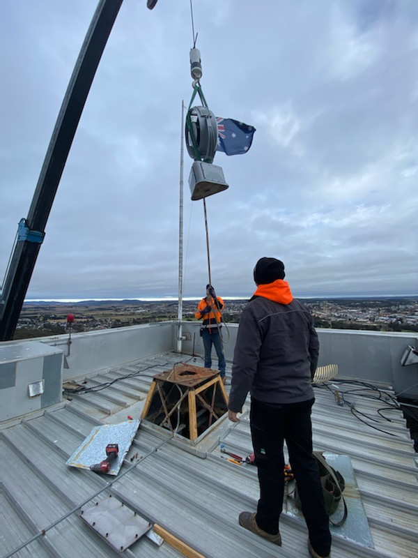 Restored beacon being lowered into position.